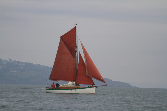 The Brixham Heritage Regatta Fleet sailing in no wind